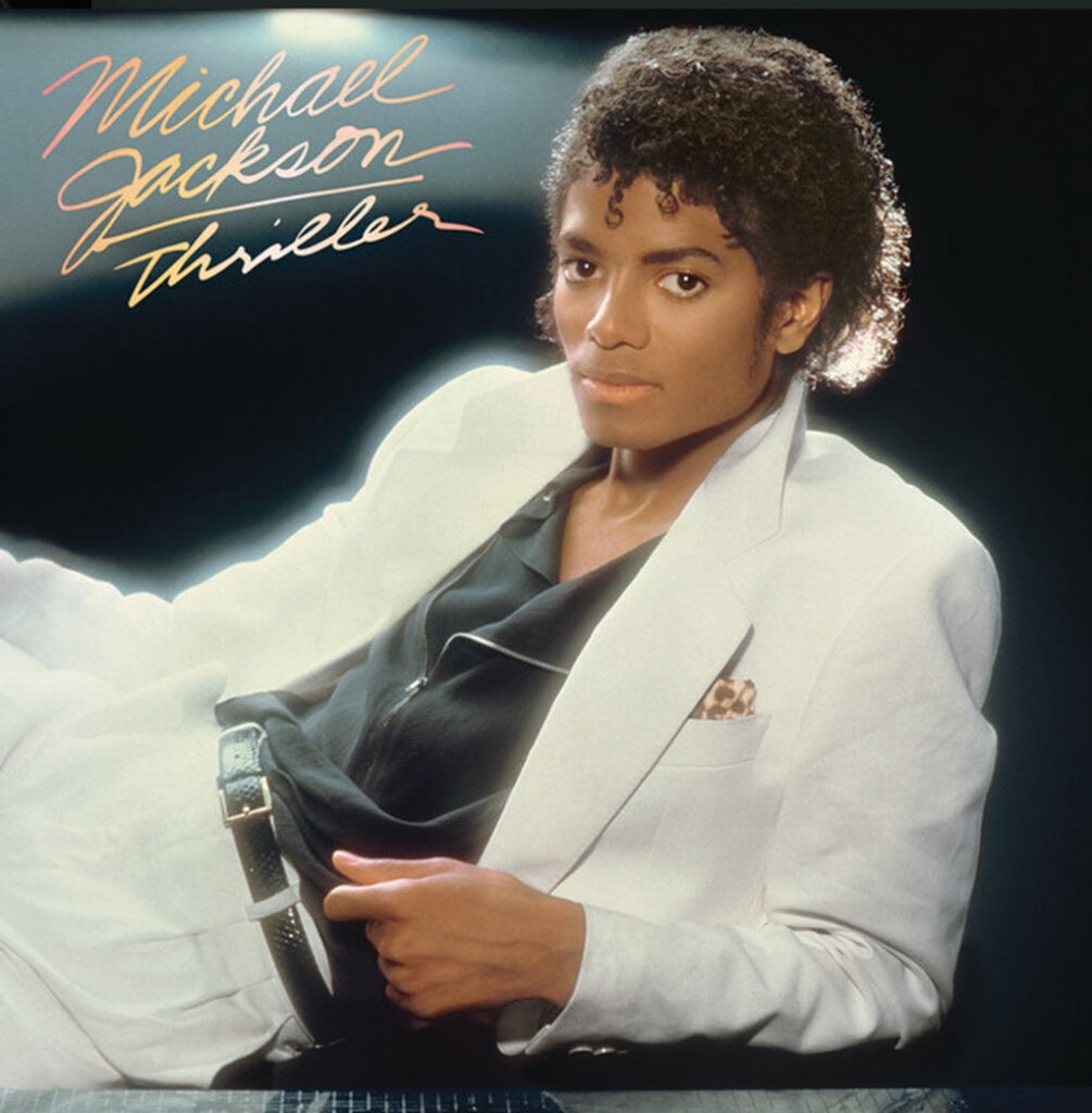 Albumcover von Michael Jackson – Thriller mit hellem Anzug und handschriftlichem Albumtitel.